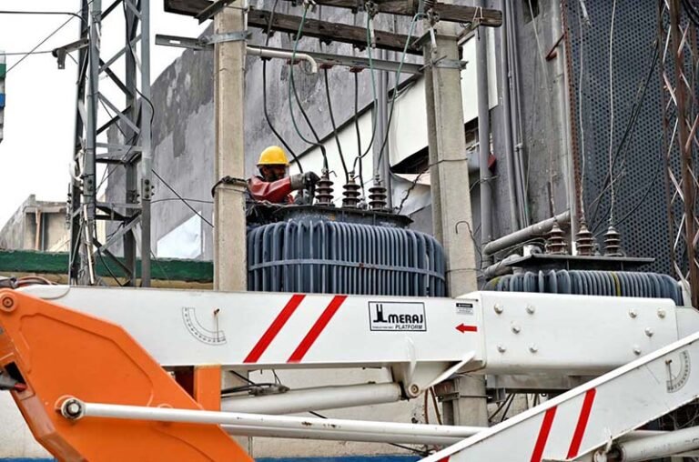 IESCO staffer is busy repairing a power transformer on electric poles to restore electricity supply after a power breakdown in Khayban-e-Sir Syed.