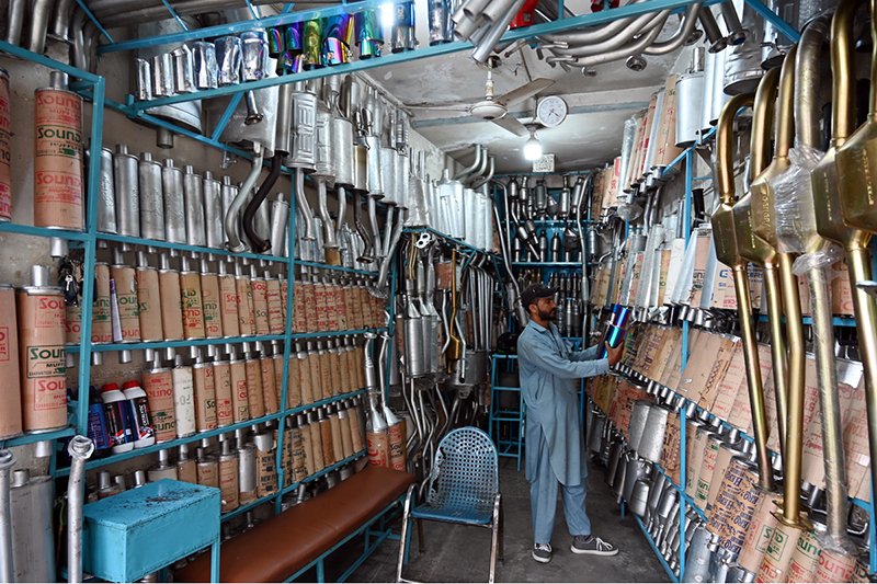 A vendor displays a wide range of car mufflers and silencers at his shop on Stadium Road