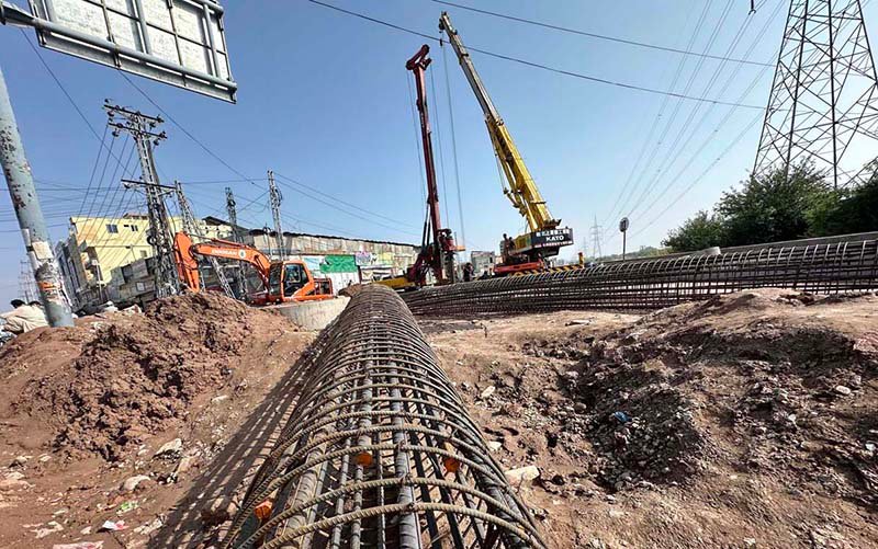 Heavy machinery is deployed for construction work on the Faizabad–Gulberg Greens Service Road project in federal capital.