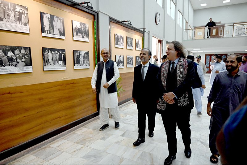Kamal Khan, grandson of Shaheed-e-Millat Nawabzada Liaquat Ali Khan, views photographs after inaugurating an exhibition marking the 75th death anniversary of the former prime minister at the National Museum of Pakistan.