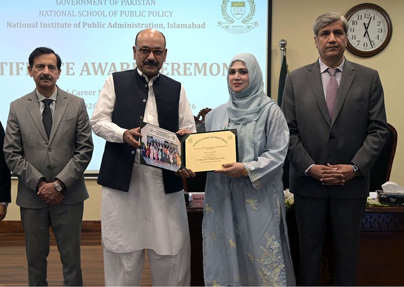 Secretary, Establishment Division, Barrister Nabeel A. Awan presents certificates to participants during the passing-out ceremony of the 47th Mid-Career Management Course at NIPA