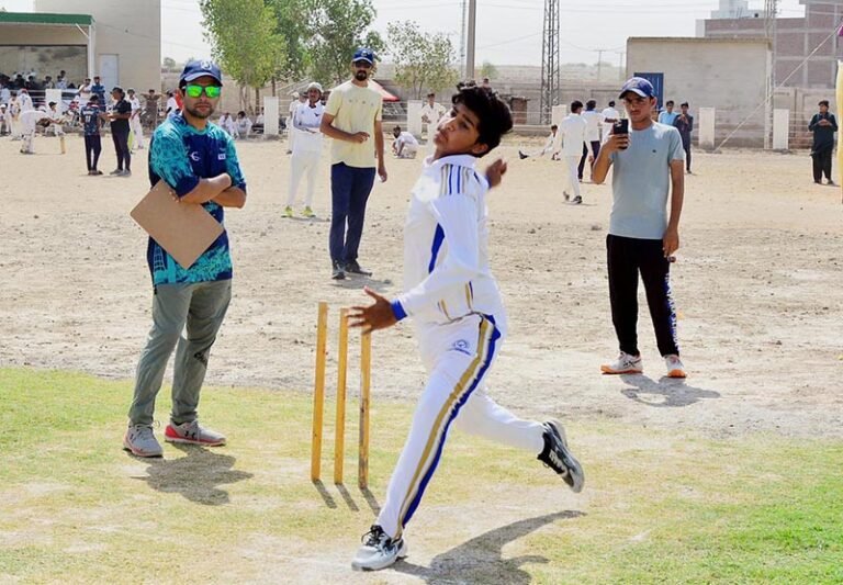 A young fast bowler gets ready to deliver the ball during the Pakistan Cricket Board (PCB) Under-17 trials for the Hyderabad Region team at the PCB Cricket Ground.