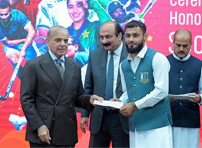 Prime Minister Muhammad Shehbaz Sharif distributes reward cheques amongst the medal winners of the Asian Games