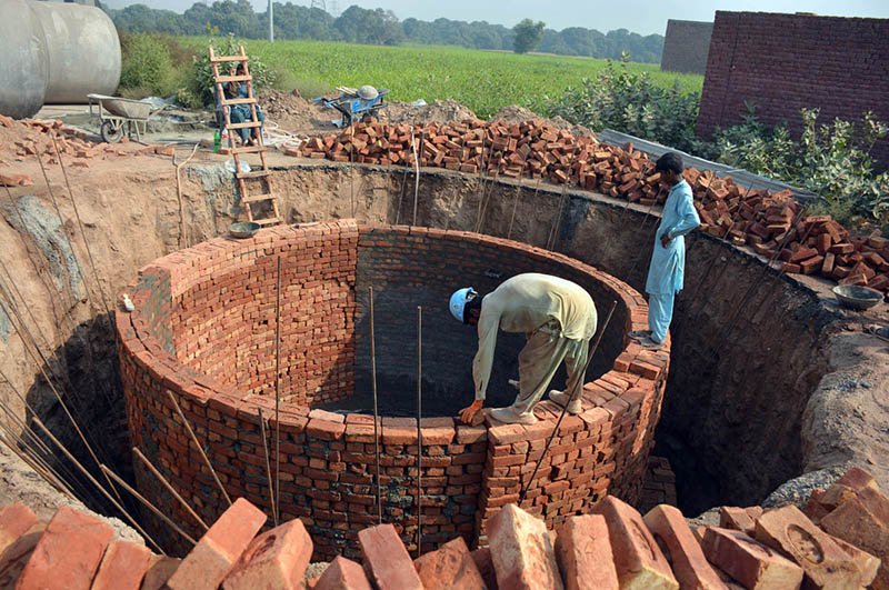 Labourers busy constructing a sewage disposal system at Nadran Bypass as part of ongoing development work