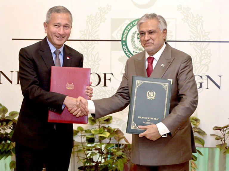 Deputy Prime Minister and Foreign Minister of Pakistan, Senator Muhammad Ishaq Dar and Minister for Foreign Affairs of Singapore, Dr Vivian Balakrishnan, exchange documents during the MoU signing ceremony at the Ministry of Foreign Affairs.