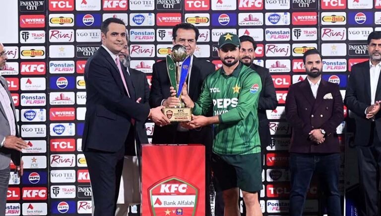 Minister of State for Interior, Talal Chaudhry presents the winning trophy to Pakistan captain Sahibzada Farhan after Pakistan won the three-match T20 series against Sri Lanka 2-1 at Rawalpindi Cricket Stadium