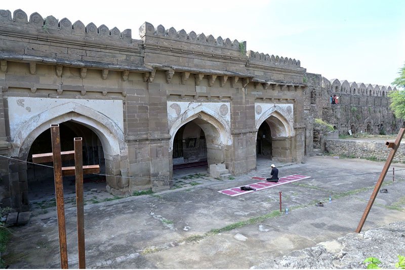 A view of Shahi Mosque (Sher Shah Suri Mosque) in Rohtas Fort. Rohtas Fort is a 16th-century fortress near Dina and Jhelum in Punjab, Pakistan. It was built in 1541 by Sher Shah Suri as a massive military stronghold and was designated a UNESCO World Heritage Site in 1997. Rohtas Fort is situated on a hill in the Tilla Jogian Range, overlooking a gorge where the Kahān River meets a seasonal stream called Parnal Khas. The fort is positioned 91.5 metres (300 ft) above its surroundings. It is 819 metres (2,687 ft) above sea level and covers an area of 70 hectares (170 acres). It is approximately 103 kilometers (64 miles) from Islamabad and is renowned for its historical significance and architectural marvels. Visitors can enjoy a guided tour that includes exploring the fort's monumental gates, palaces, barracks, and mosques