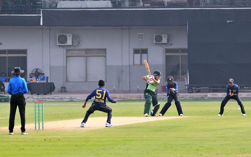 Cricket players in action during the cricket match between Pakistan Under-17 and Sri Lanka Under-17 teams as Pakistan chase a target of 240 runs set by Sri Lanka at Multan Cricket Stadium.