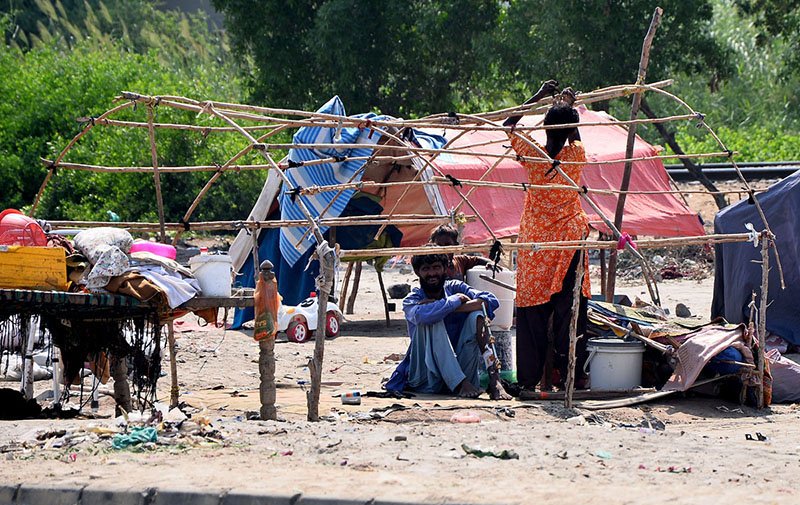 A gypsy woman prepares her hut in the Makki Shah area