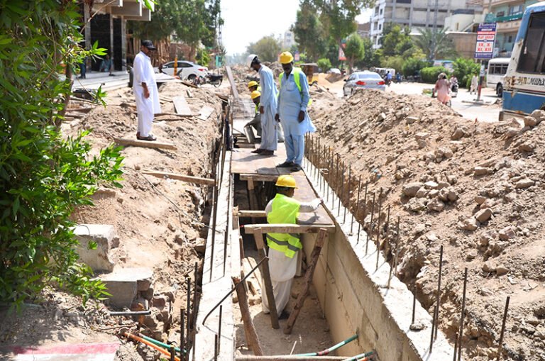 Labourers constructing a work on the drain as part of development work on Autobahn Road