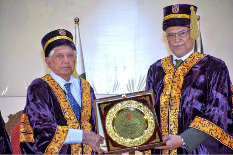 Prof. Dr. Rashid Latif Khan, Vice Chancellor of RLKU, presents a shield to Federal Minister for Planning, Development and Special Initiatives Ahsan Iqbal during the 7th convocation ceremony at Rashid Latif Medical and Dental College