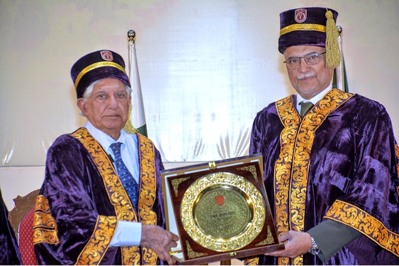 Prof. Dr. Rashid Latif Khan, Vice Chancellor of RLKU, presents a shield to Federal Minister for Planning, Development and Special Initiatives Ahsan Iqbal during the 7th convocation ceremony at Rashid Latif Medical and Dental College