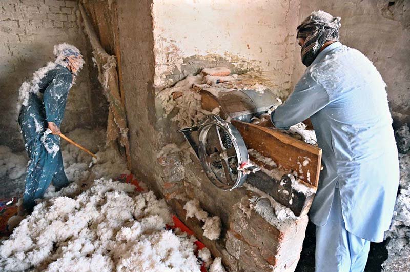 A worker prepares cotton at his workplace to fill quilts in the Factory Area