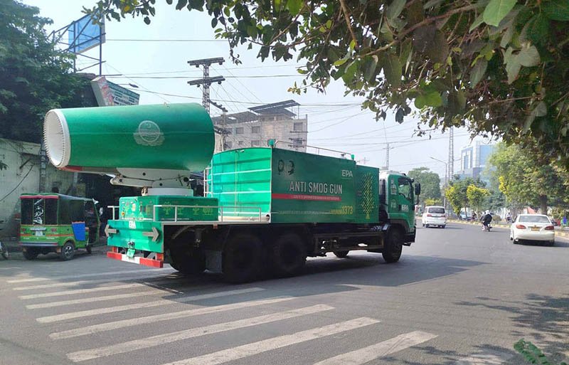 An Environmental Protection Agency (EPA) anti-smog gun vehicle equipped with a dust suppression system patrols near the NADRA office to help reduce smog.