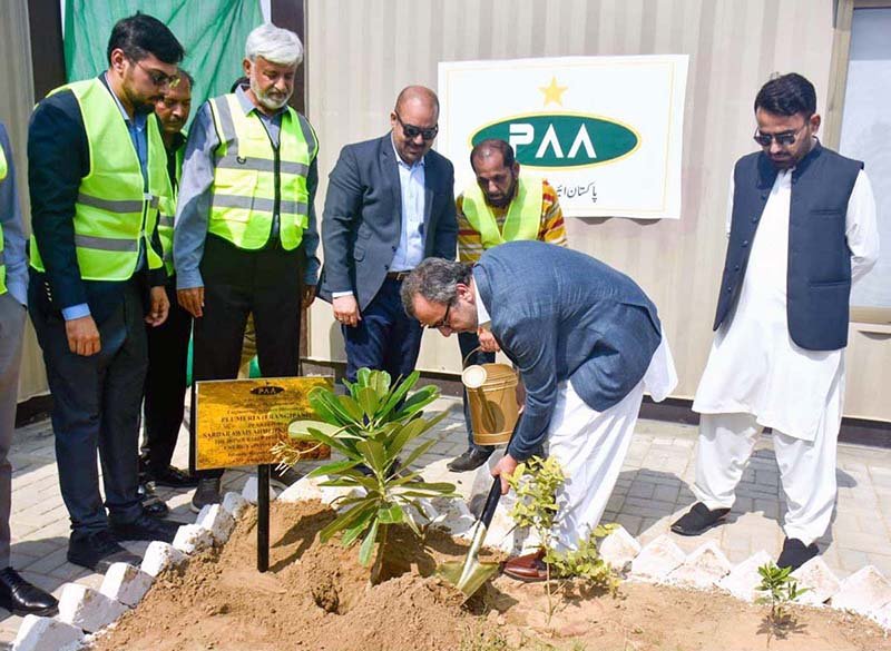 Federal Minister for Energy Sardar Awais Ahmad Khan Leghari is planting a sapling at the Sardar Farooq Ahmad Khan Legari Airport