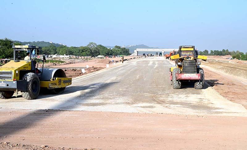Labourers are busy construction work at Park Road during development work in Federal Capital.