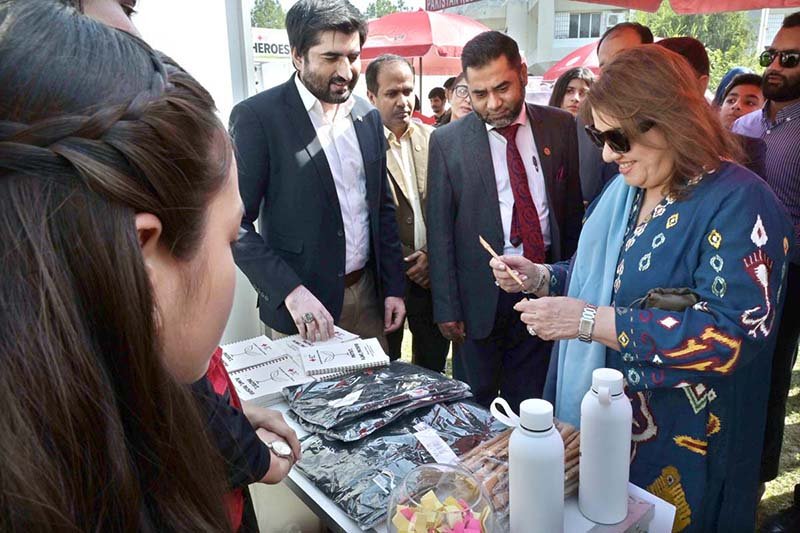 Chairperson PRCS Farzana Naek visiting a stall during an event “Community Voice to COP31 from Negotiations to Implementation” organized by Pakistan Red Crescent Society