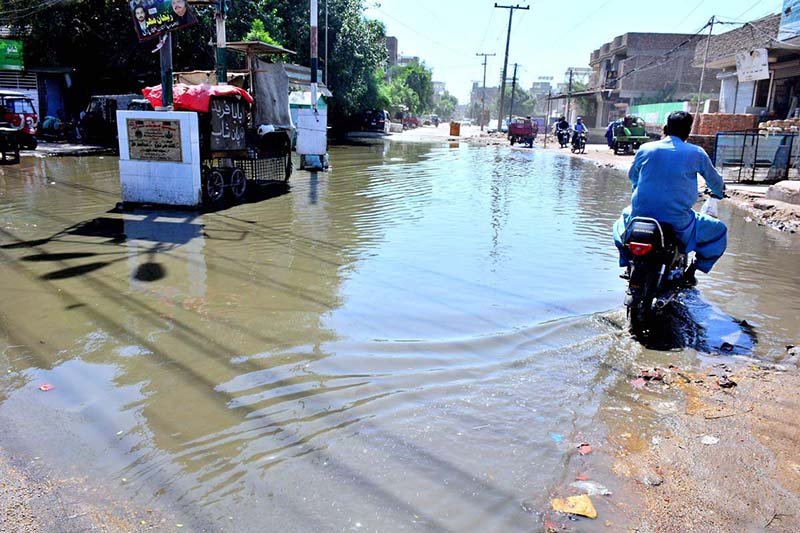 Stagnant sewage water accumulates on a road near Khuda Hafiz Board Chowk, causing inconvenience to commuters.