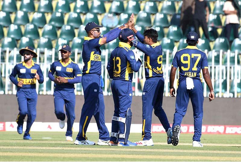 Sri Lankan players celebrate after dismissing England batter Tom Banton during the ODI Tri-Nation Series cricket match between England and Sri Lanka at Rawalpindi Cricket Stadium
