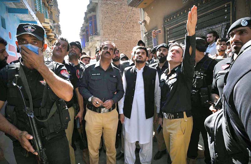 Capital City Police Officer (CCPO) Dr. Mian Saeed inspects the collapsed school building during a visit to Dir Colony.