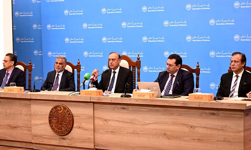 State Bank Governor Jameel Ahmad announces the monetary policy decision at a press conference.