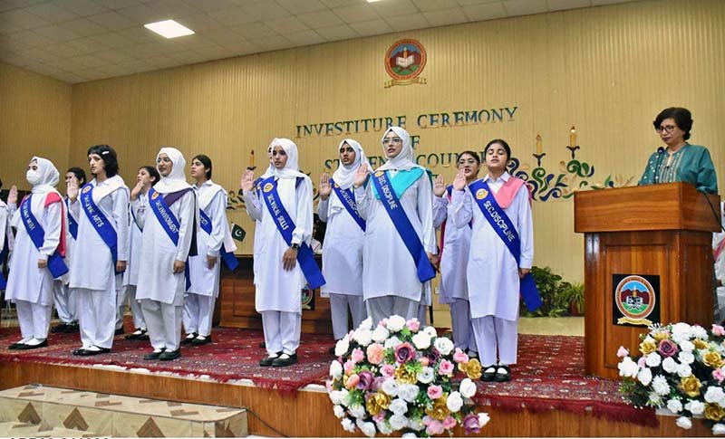 Newly elected Student Council office-bearers take the oath from chief guest Dr Amna Malik during a ceremony at Model College for Girls, F-7/2