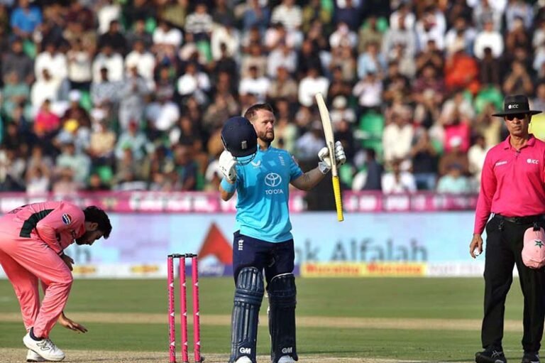 England’s batter Ben Duckett celebrates after completing his century during the one-day international (ODI) tri-nation series match between Pakistan and England at Gaddafi Stadium