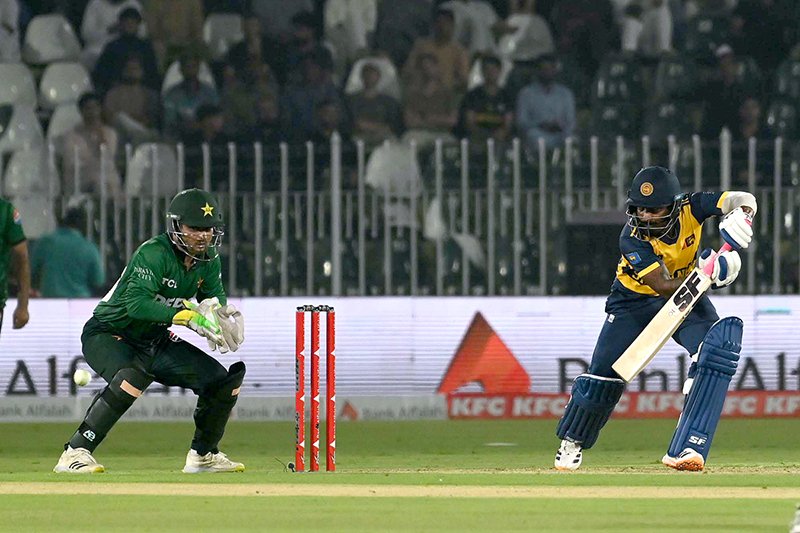 Sri Lankan batter Lahiru Udara plays a shot during the T20 cricket match between Pakistan and Sri Lanka at Rawalpindi Cricket Stadium.