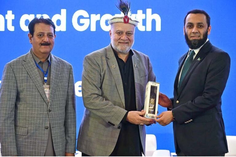 Federal Minister for Poverty Alleviation and Social Safety, Syed Imran Ahmed Shah presenting gift to Federal Minister for Information and Broadcasting, Attaullah Tarar during the International Conference on “Inclusive and Resilient Economic Empowerment and Growth” organized by Pakistan Poverty Alleviation Fund (PPAF) at local hotel