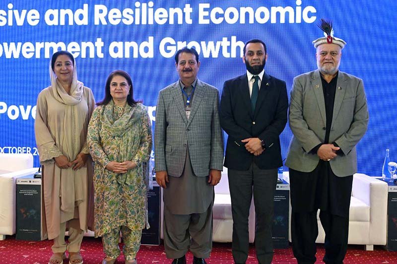 Federal Minister for Information and Broadcasting, Attaullah Tarar in a group photograph during the International Conference on "Inclusive and Resilient Economic Empowerment and Growth" organized by Pakistan Poverty Alleviation Fund (PPAF) at local hotel