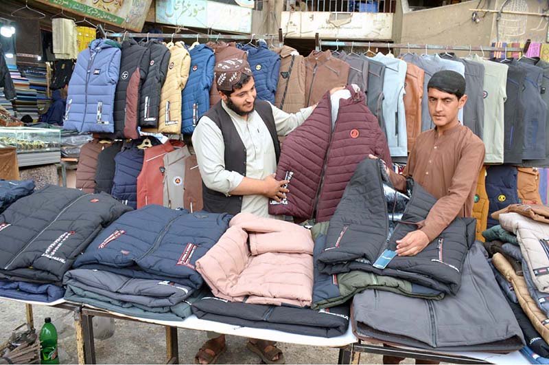Vendor set up winter coats for customers near main Chowk