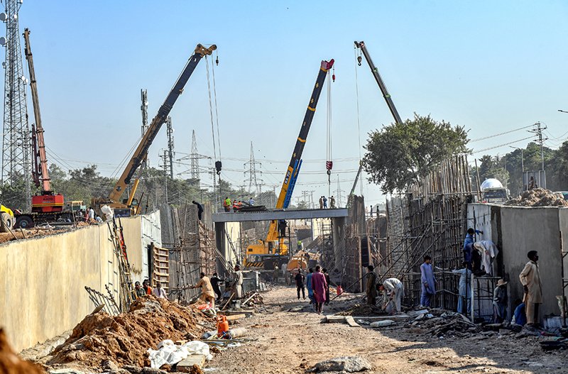 Heavy machinery is being used in the ongoing underpass construction project at Kashmir Chowk during development work in the Federal Capital