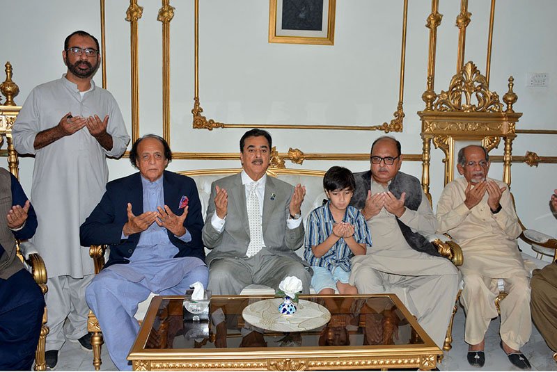Chairman Senate Syed Yousaf Raza Gilani offers Fateha for the departed soul of late former minister Malik Mukhtar Ahmad Awan at his residence