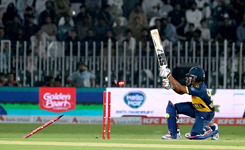 Sri Lankan batter Dunith Wellalage is bowled out during the T20 cricket match between Pakistan and Sri Lanka at Rawalpindi Cricket Stadium.