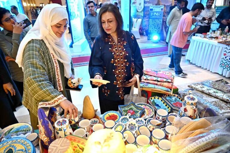 Visitors explore stalls during International Conference on “Inclusive and Resilient Economic Empowerment and Growth” organized by Pakistan Poverty Alleviation Fund (PPAF) at local hotel