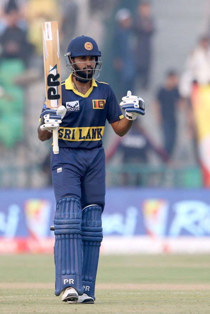 Sri Lankan batter Pavan Rathnayake celebrates his fifty run score during the One-Day International (ODI) Tri-Nation cricket series final match playing between Sri Lanka and Pakistan at the Gaddafi Cricket Stadium