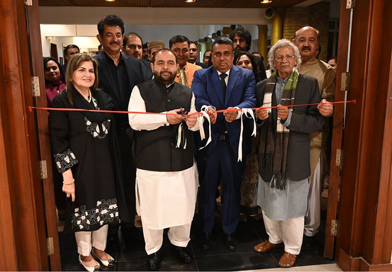 Federal Minister for National Heritage and Culture Aurangzeb Khan Khichi cuts a ribbon to inaugurate a painting exhibition by artists of the visiting Bangladeshi delegation, organized by the National Heritage and Culture Division at the Pakistan National Council of the Arts (PNCA)