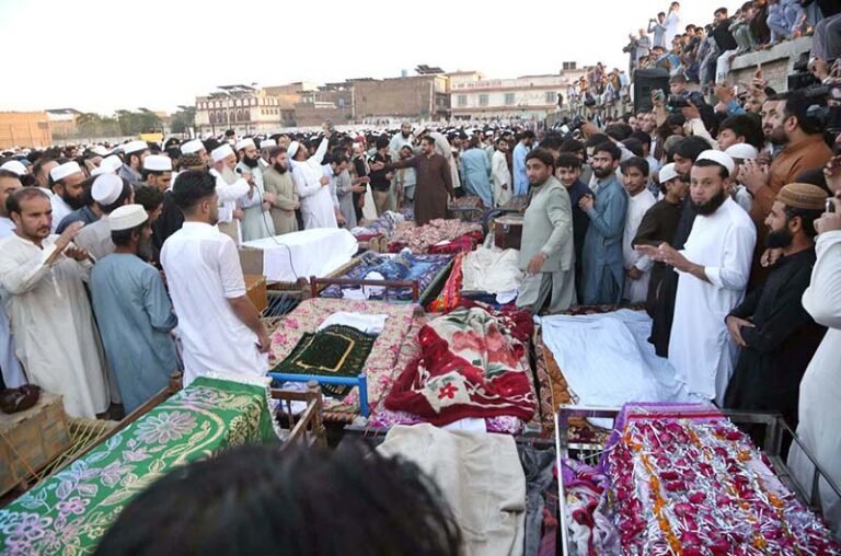 The bodies of children who lost their lives in the school building collapse are brought to Dir Colony for funeral prayers.