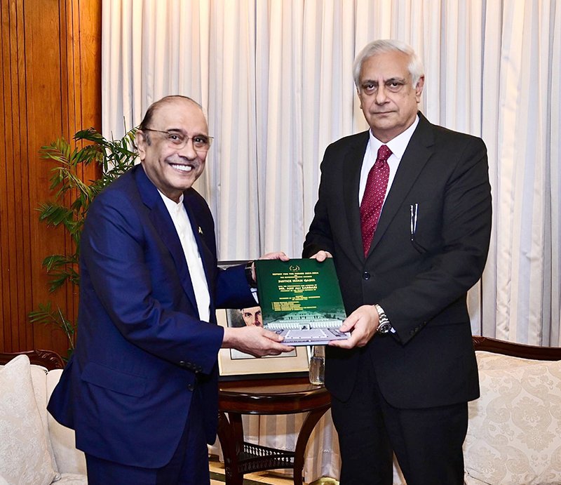 President Asif Ali Zardari receiving a report from Justice Irfan Qadir, Consultant (Legal Affairs) to the President, regarding the disposal of representations from 2024 to 2026, at Aiwan-e-Sadr.