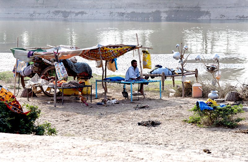 A view of makeshift huts set up by gypsy families near Rice Canal