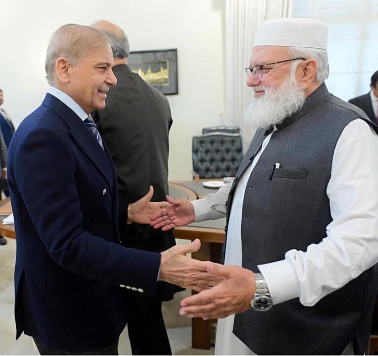 Prime Minister Muhammad Shehbaz Sharif shaking hands with Jamaat Islami leader Liaqat Baloch at Prime Minister’s House.