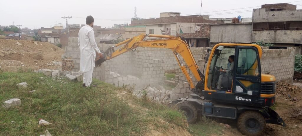 RDA demolishes illegal under-construction building in Chak Jalal Din